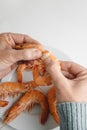 closeup of a man about to eat a cooked prawn Royalty Free Stock Photo