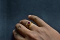 Closeup of man wearing gold ring on his hand. selective focus Royalty Free Stock Photo