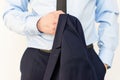 Closeup Man wearing in suit standing and holdsng jacket in his hand, anouther hand in pocket. Royalty Free Stock Photo