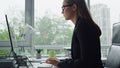 Closeup manager typing computer in office. Beautiful businesswoman ponder issue