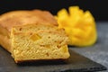 Closeup mango cake on black backround, homemade pound cake