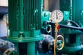 Closeup of manometer, measuring gas pressure. Pipes and valves a Royalty Free Stock Photo