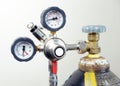 Closeup of manometer, measuring gas pressure. Pipes and valves at industrial plant. Royalty Free Stock Photo