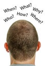 Closeup of mans head with questions. Royalty Free Stock Photo