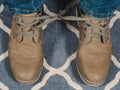 Closeup mans shoelaces tied together, April fools day