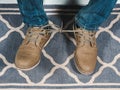 Closeup mans shoelaces tied together, April fools day