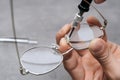 Closeup of manufacturing medical glasses with ophthalmology tool in clinic office