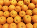 Closeup of many oranges on a fruit shop in market of Thailand. Fresh orange for sale in supermarket. Royalty Free Stock Photo