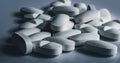 Closeup of many white prescription drugs, medicine tablets or vitamin pills in a pile - Concept of healthcare or opioids addiction