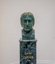 Closeup of a marble-based statue of JMW Turner