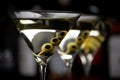 Closeup Martini drinks with stick in bar on black Royalty Free Stock Photo