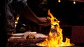 Closeup of a master making a glass jar in a fire in Istanbul, Turkey