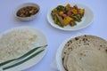 Closeup of matar paneer veg, mashroom soup, roti chapati and rice Indian food isolated over white background