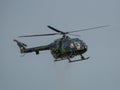 Closeup of MBB Bo105 helicopter flying in the sky at an air show in Slovakia