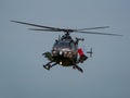 Closeup of MBB Bo105 helicopter flying in the sky at an air show in Slovakia with Polish flag