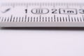 Closeup of a measuring stick. Scale for measuring distance Royalty Free Stock Photo