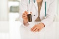 Closeup on medical doctor showing medicine bottle Royalty Free Stock Photo