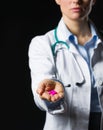 Closeup on medical doctor woman showing pills Royalty Free Stock Photo