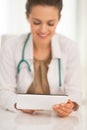 Closeup on medical doctor woman using tablet pc Royalty Free Stock Photo