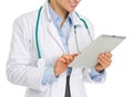 Closeup on medical doctor woman using tablet pc Royalty Free Stock Photo