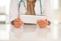 Closeup on medical doctor woman using tablet pc Royalty Free Stock Photo