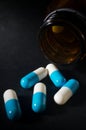 Closeup medicine capsules and bottle.