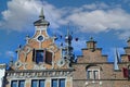 Closeup of medieval gabled house facades with church tower against blue summer sky - Nijmegen, Netherlands