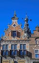 Closeup of medieval gabled house facades with church tower against blue summer sky - Nijmegen, Netherlands