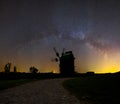 Closeup medieval windmill silhouette on a night sky background Royalty Free Stock Photo