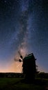 Closeup medieval windmill silhouette on a night sky background