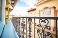 closeup of a mediterranean balcony with iron railings
