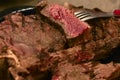 closeup medium rare beef steak in hot plate