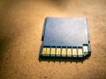 A closeup of a memory card lying on the table Royalty Free Stock Photo