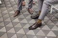 Closeup men wearing smart formal brown leather shoes