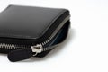 Closeup mens wallet black leather zipper pouch isolated on white background