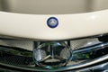 Closeup of Mercedes Benz logo design / brand name on front grill