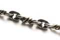 Closeup of a metal chain links with intertwine interweave twisted patterned metal works