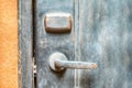 Closeup metal door with lock in grungy style and good texture. Royalty Free Stock Photo