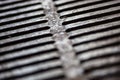 Closeup of the metal drain grate surface Royalty Free Stock Photo