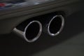 Closeup of metal exhaust pipe of sports car Royalty Free Stock Photo