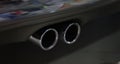 Closeup of metal exhaust pipe of sports car Royalty Free Stock Photo