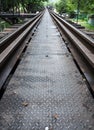 Closeup of the metal pathway on the old railway bridge. Royalty Free Stock Photo