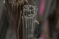 Closeup of metal rods in a container under the lights with a blurry background Royalty Free Stock Photo
