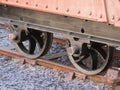 Closeup of metal train wheels on the track during daylight Royalty Free Stock Photo