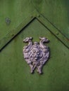 Closeup of metallic ornament with lion and griffons