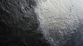 A closeup of metallic paint with a subtle gradient transitioning from a deep black to a gleaming silver