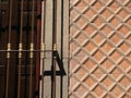 Closeup of a metallic window fence on a building under the sunlight