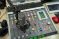 Closeup Microphone with Audio Console and Computers Setup Royalty Free Stock Photo