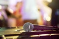 Closeup microphone on black table in a party