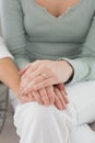 Closeup mid section of female friends touching hands Royalty Free Stock Photo